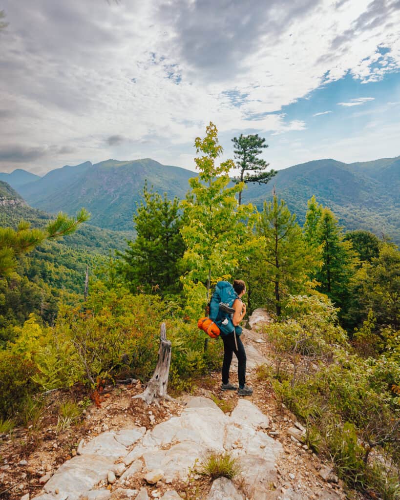 Women backpacker confident while tackling the Linville Gorge trail in North Carolina