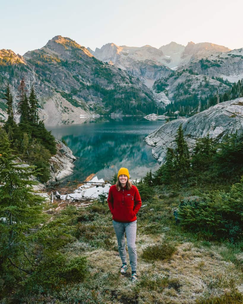 woman backpacker enjoying sunrise in the Alpine Lakes Wilderness