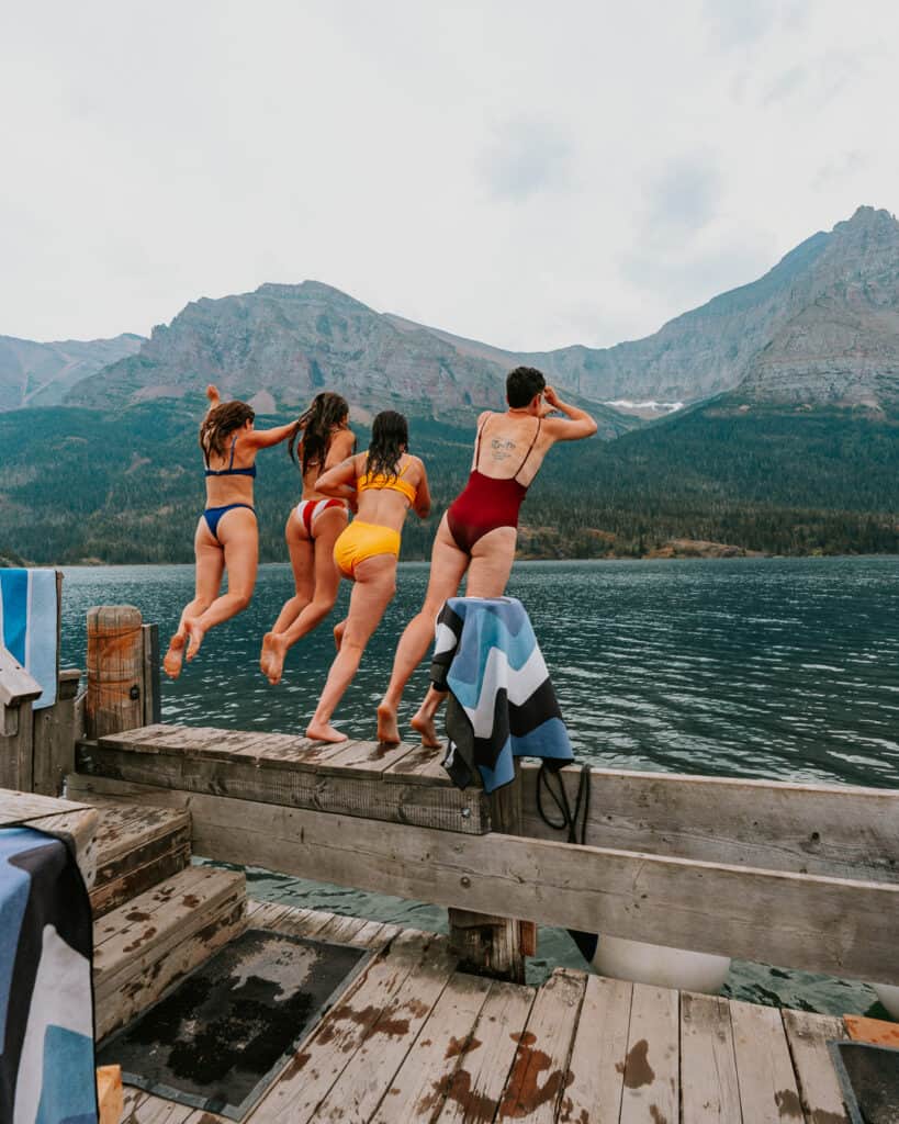 Group jump into St. Mary Lake